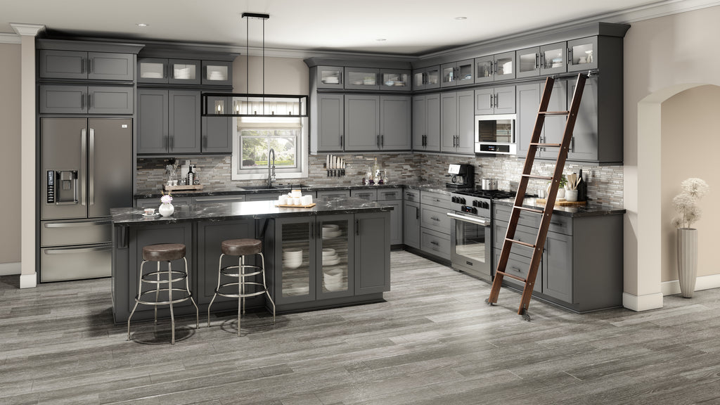 Modern kitchen with gray cabinets, island, and appliances.