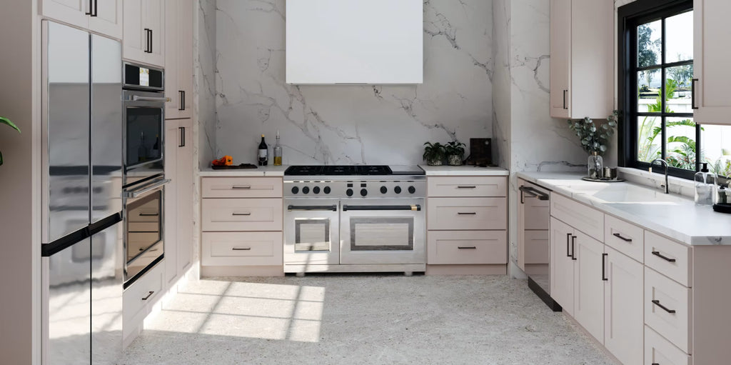 Modern shaker pink beige kitchen with stainless steel appliances and white cabinets.