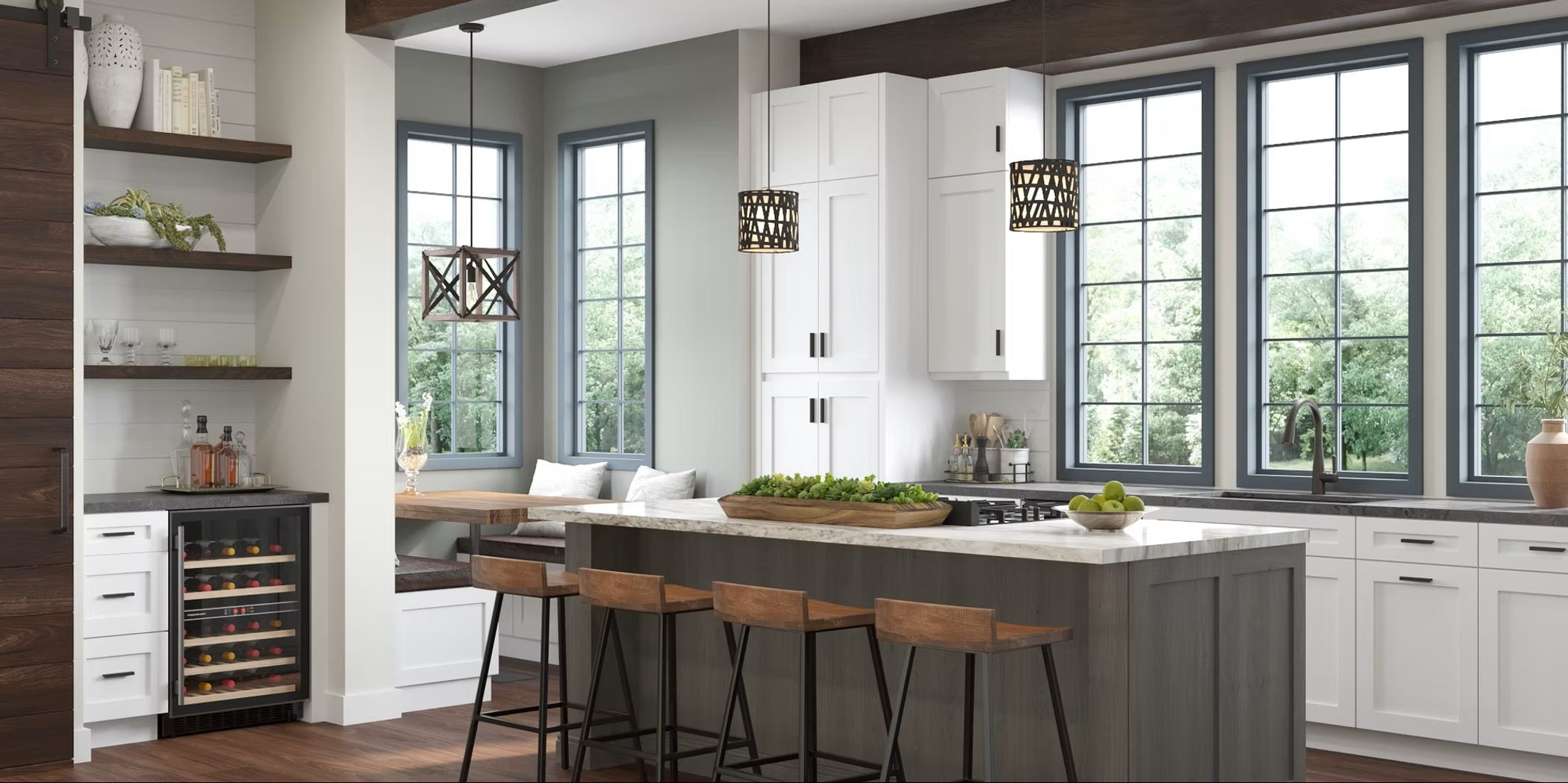 Modern kitchen with white shaker cabinets, a grey island, wooden bar stools, and large windows.